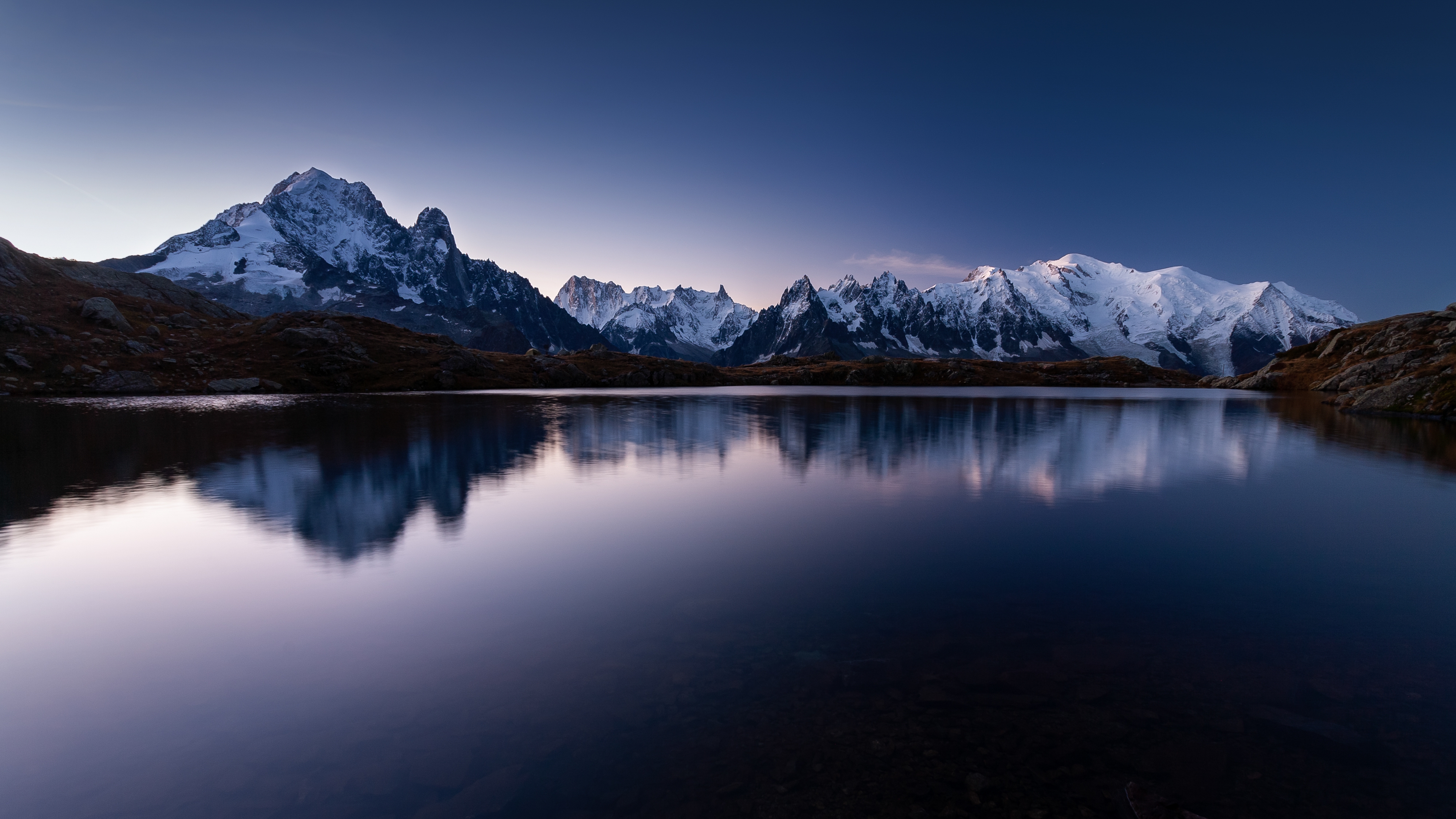 mount-mont-blanc-covered-snow-reflecting-water-evening-chamonix-france.jpg